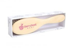 Wooden hair brush for baby standing in box