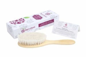Soft baby brush with wooden handle, nest to box.